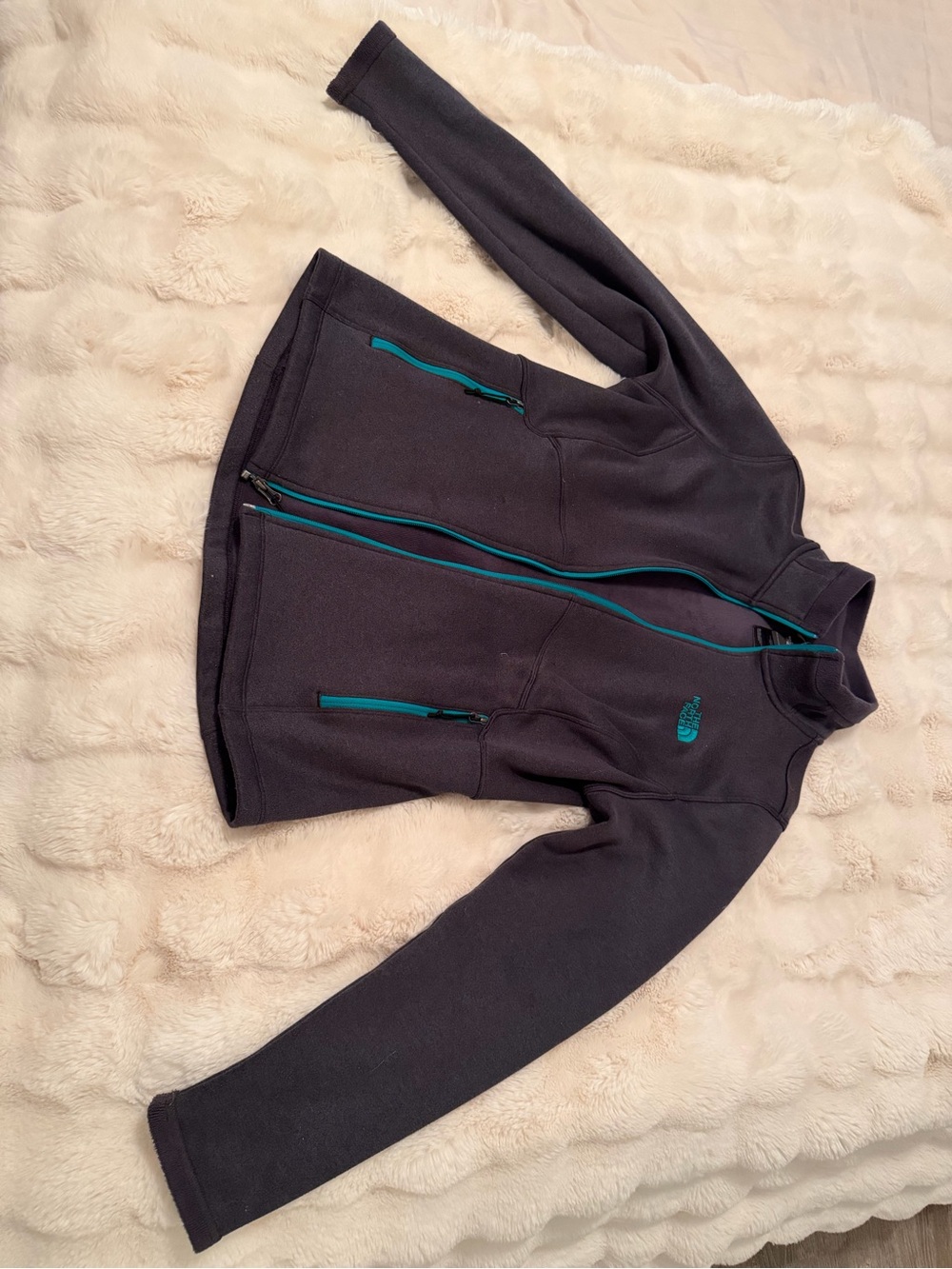 The North Face woman’s Dark Gray Full-Zip Fleece with Teal Accents